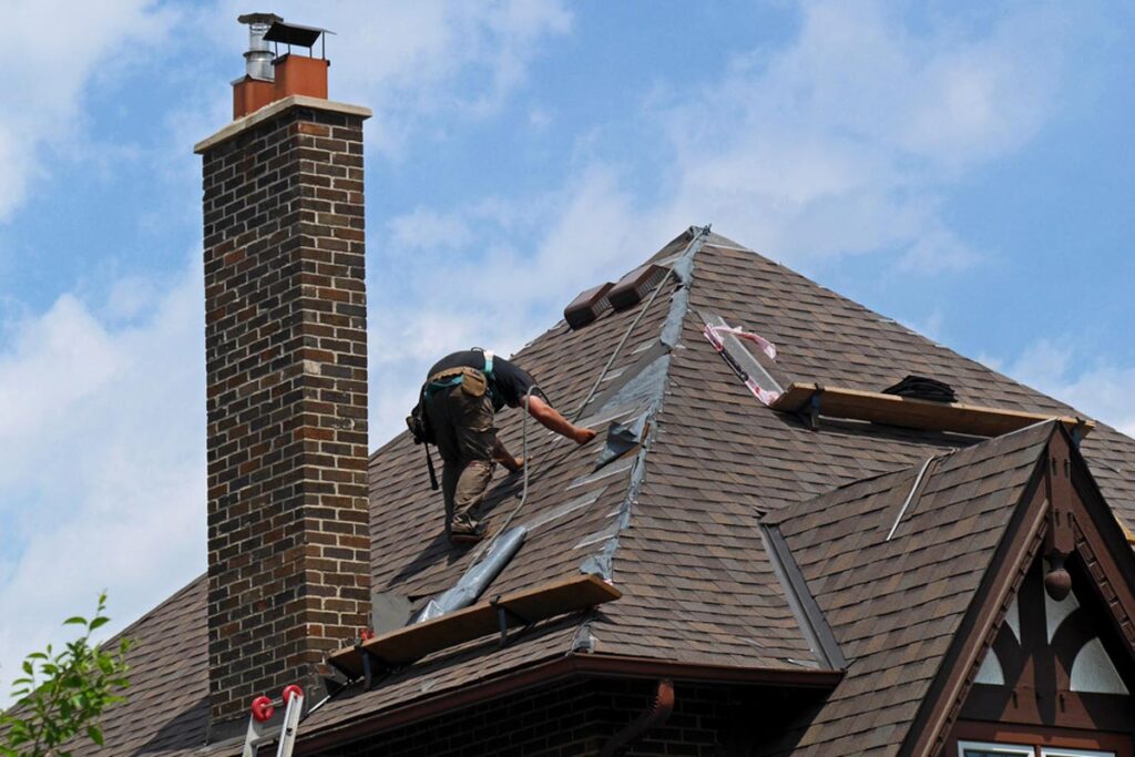 homeguide-contractor-repairing-roof-leak-and-replacing-shingles-from-storm-damage